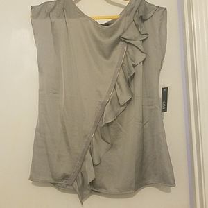 Silky silver top ith ruffle angled with fake zippe